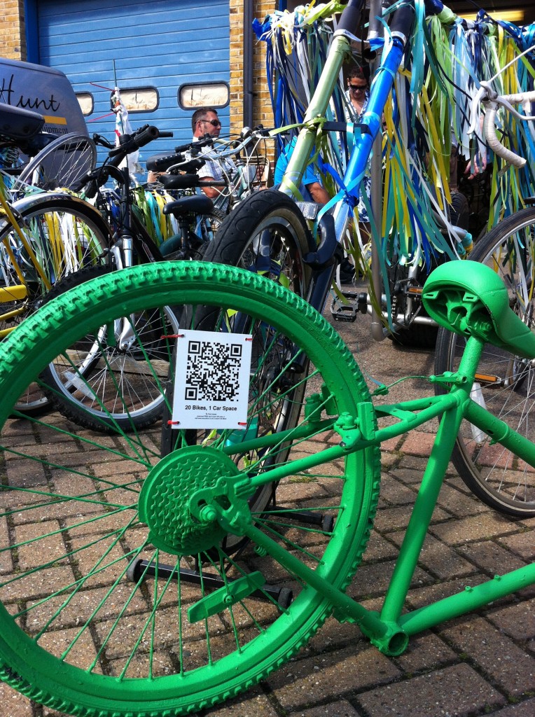 a green bike with reCyculture virtual installation signage
